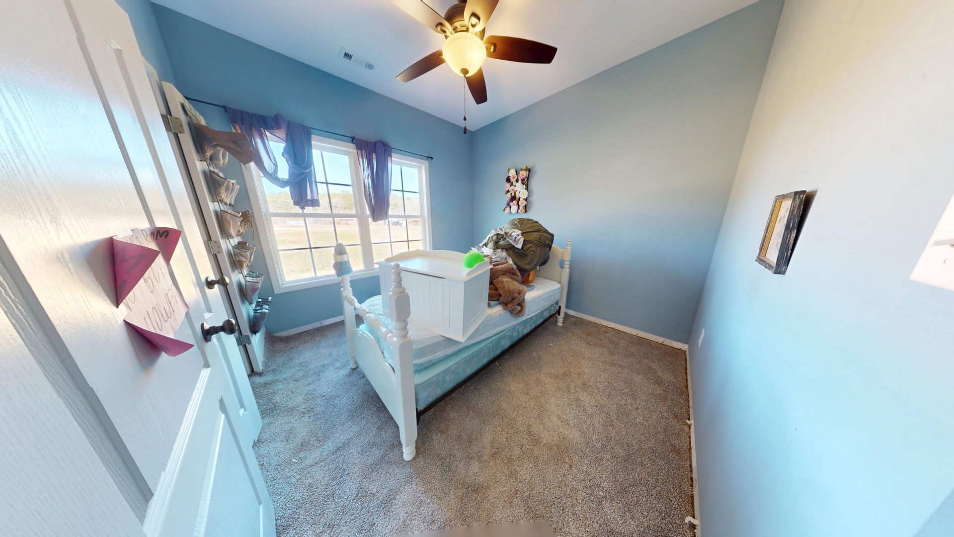 Kids room before water damage restoration with damaged carpet