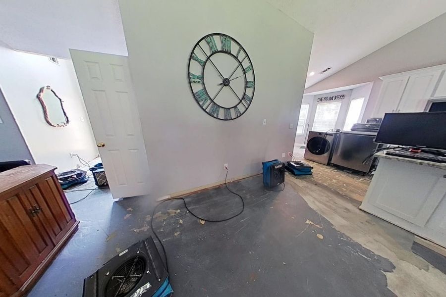 Water damage across a kitchen and dining room floor in an Atlanta home