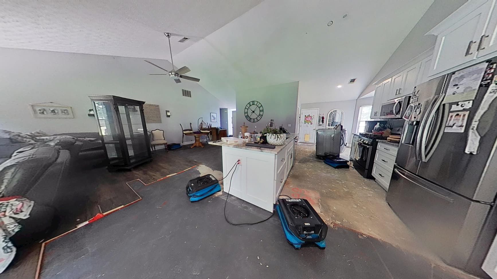 Kitchen and living room before water damage restoration in Buford