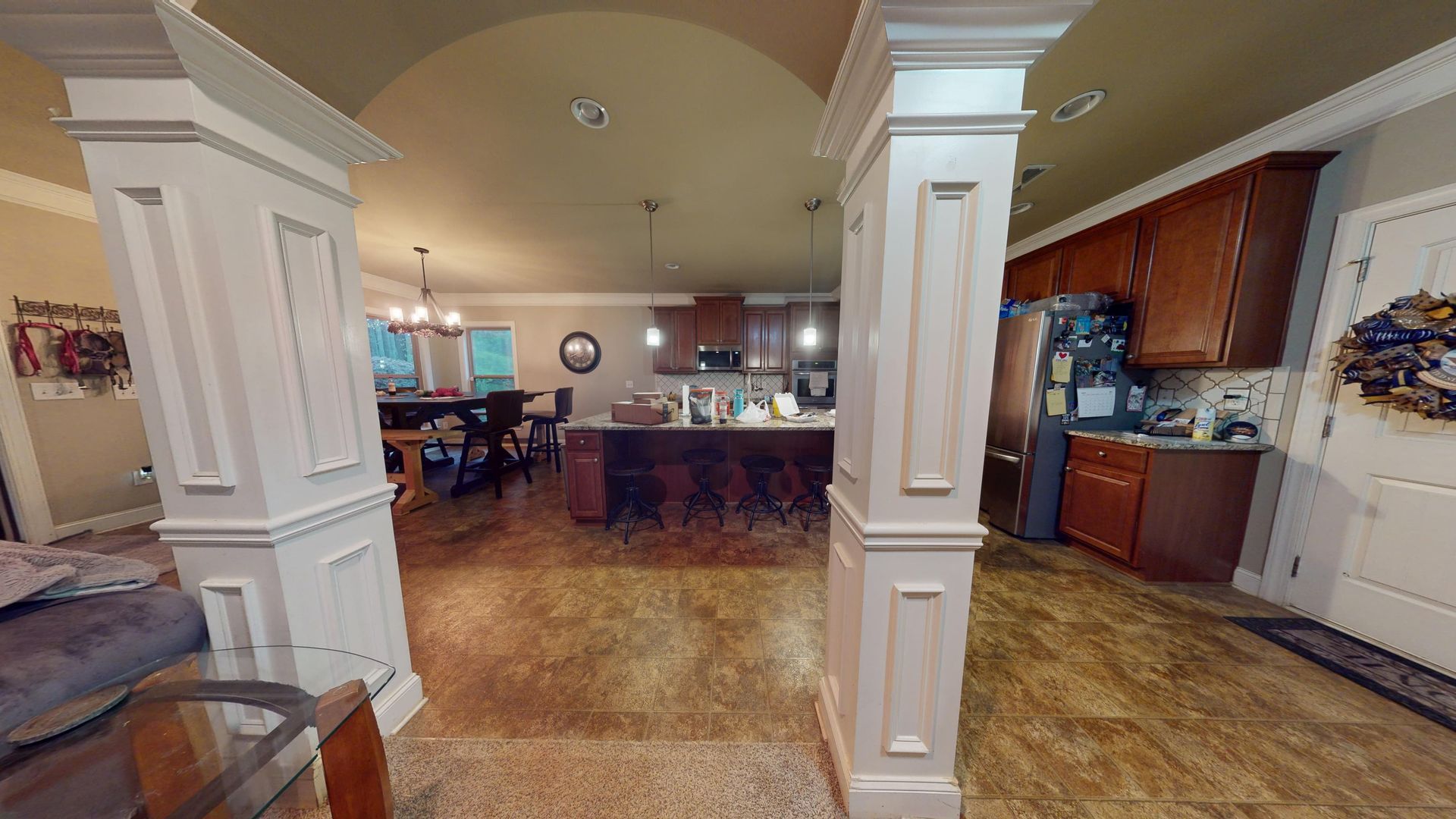 Flooded kitchen with standing water and water-damaged flooring before restoration in a Palmetto home