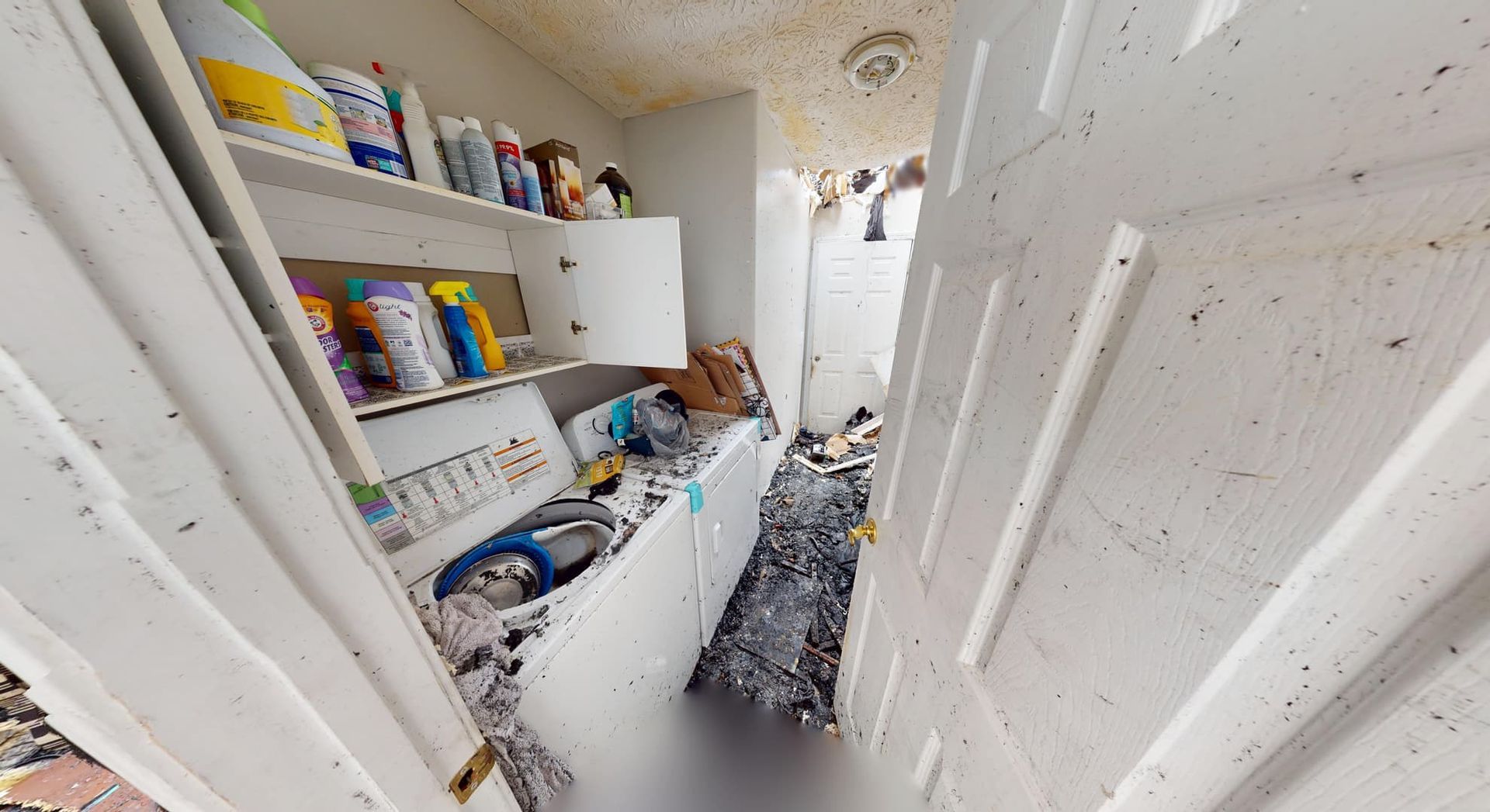 Smoke damaged laundry room before fire restoration in Loganville residence
