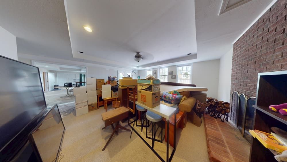 Living room before water damage restoration showing flood damage in Alpharetta home