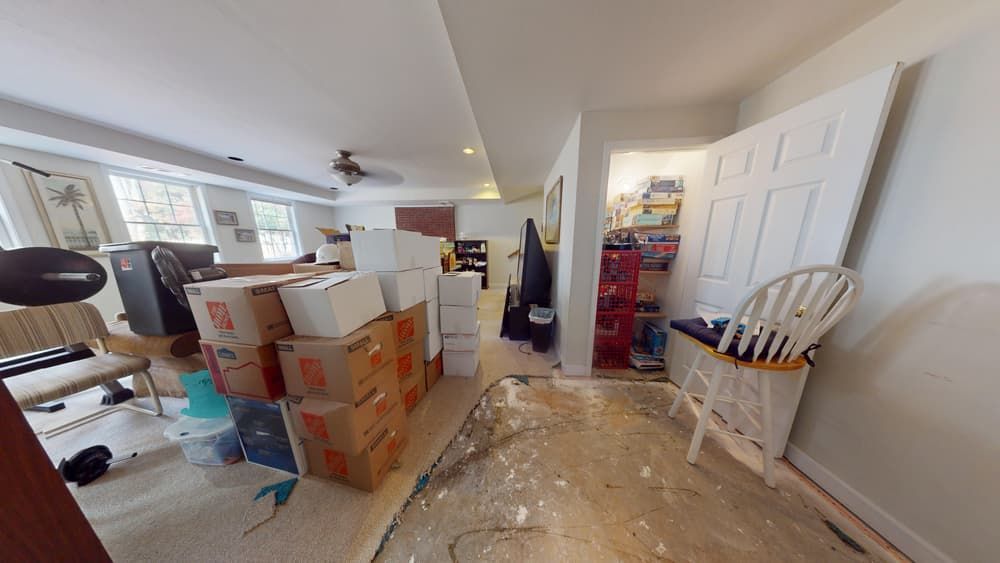 Home office before water damage cleanup showing flood impact