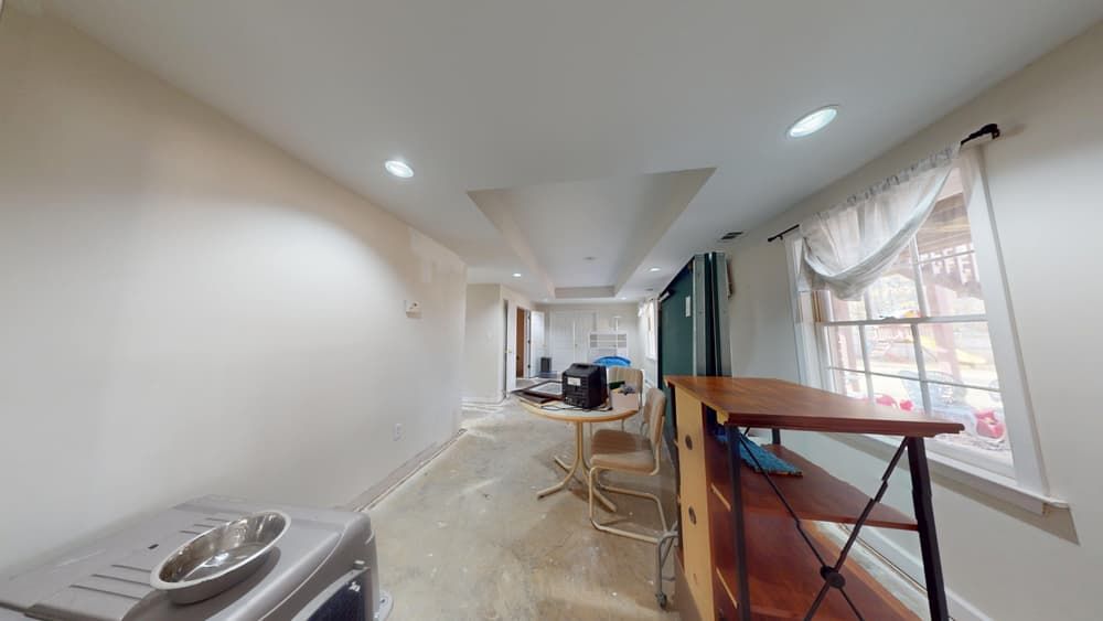 Second view of office showing water damage before restoration