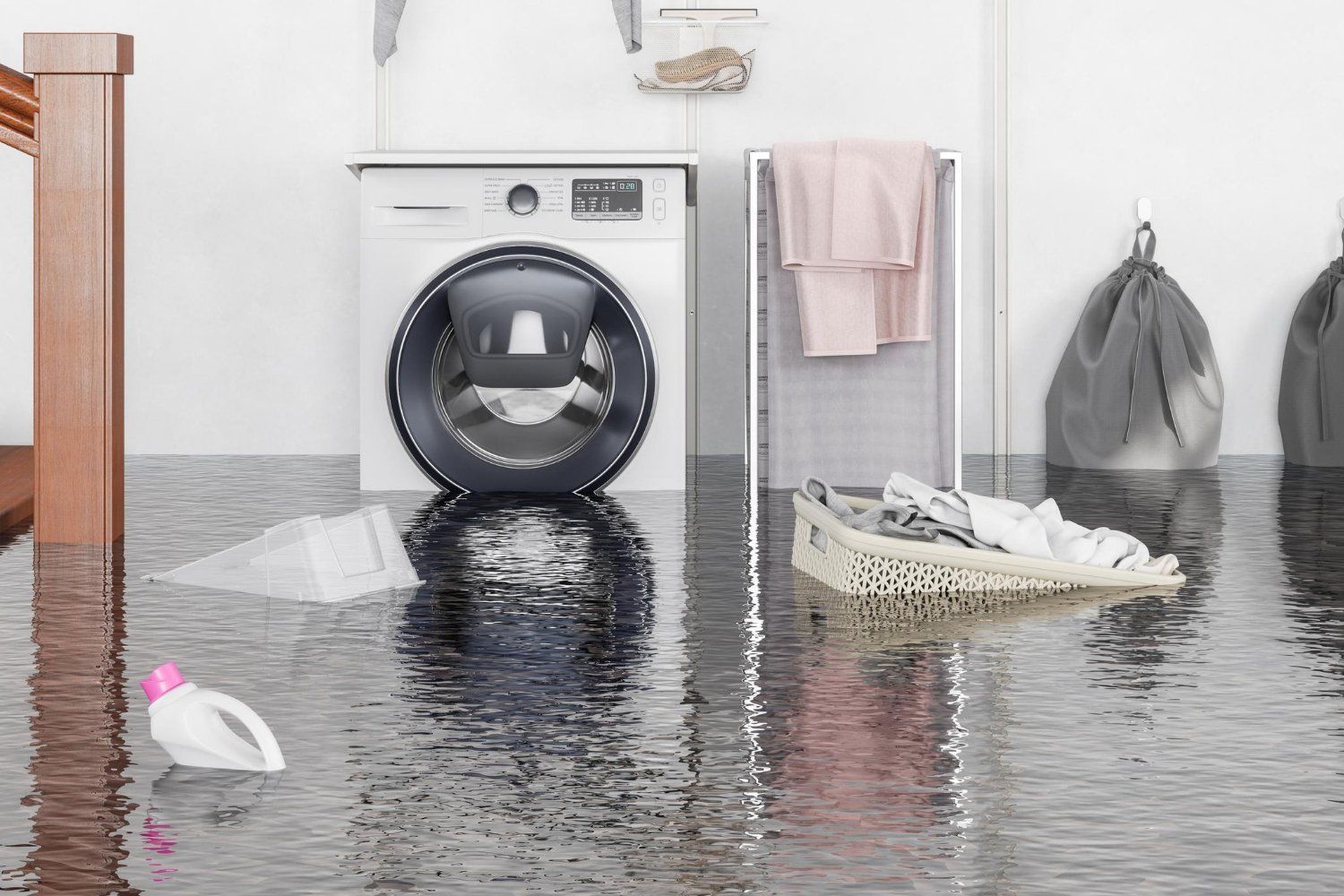 Flooded laundry room. A washing machine, laundry basket, and detergent bottle are partially submerged in water.