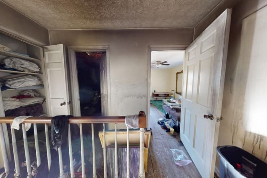 Soot and smoke residue covering walls and surfaces inside a fire-damaged home in Atlanta