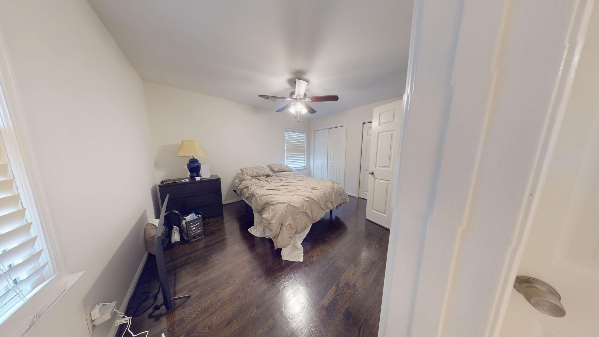 Bedroom with soaked carpet and wet baseboards during water cleanup in a Sandy Springs home