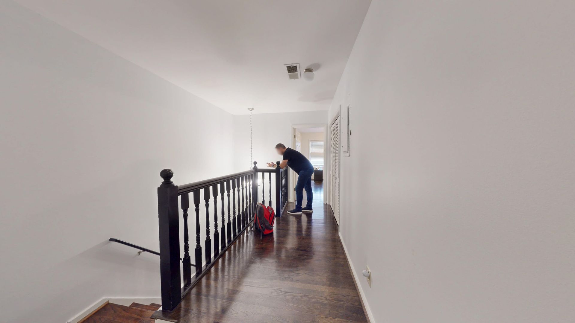 Water-damaged hallway flooring that carried moisture between rooms in a Sandy Springs home
