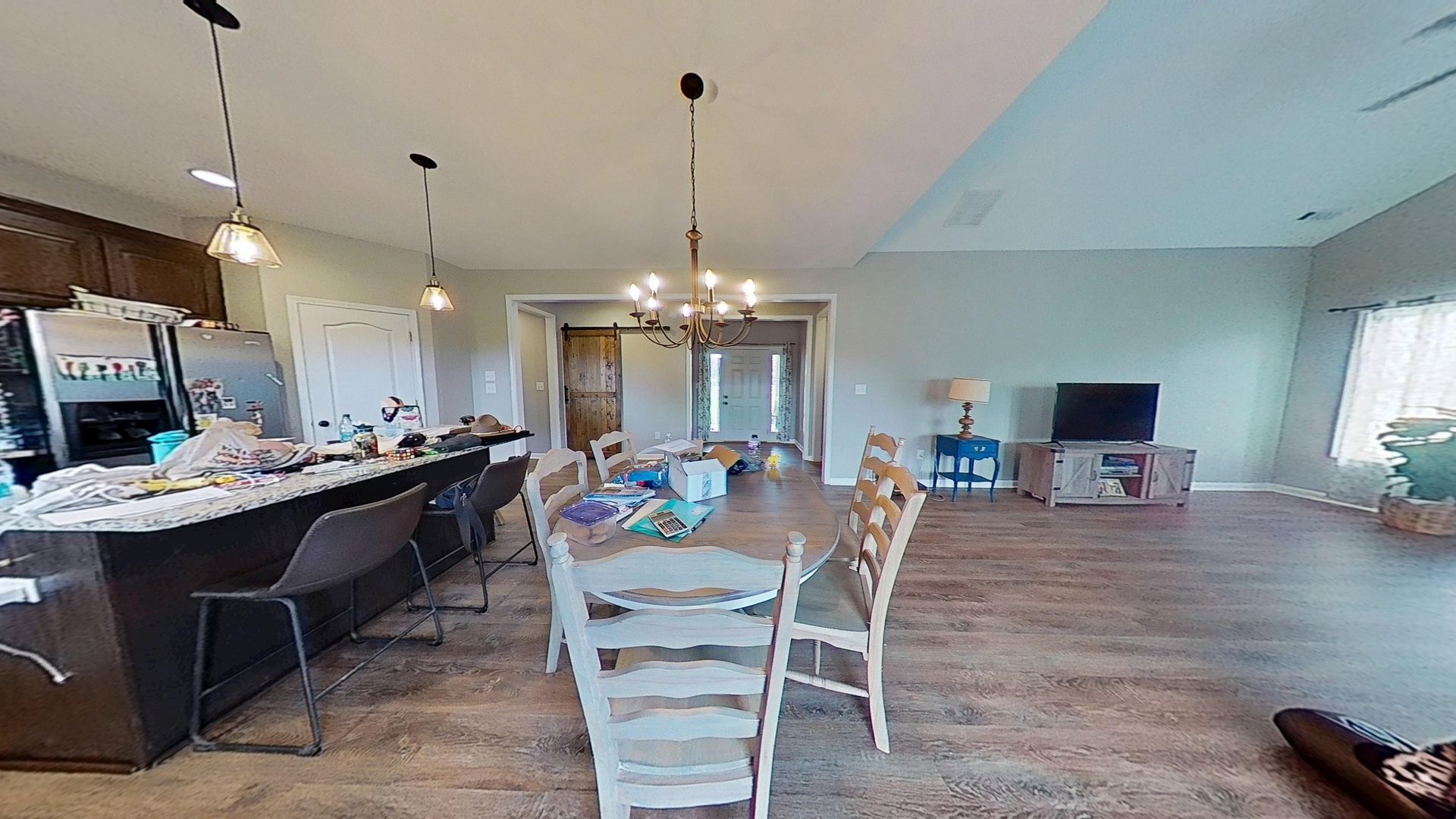 Kitchen and dining room after restoration with new flooring installed