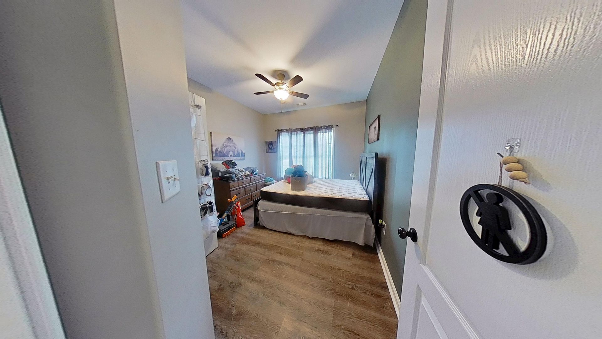 Second bedroom after water damage restoration with new flooring