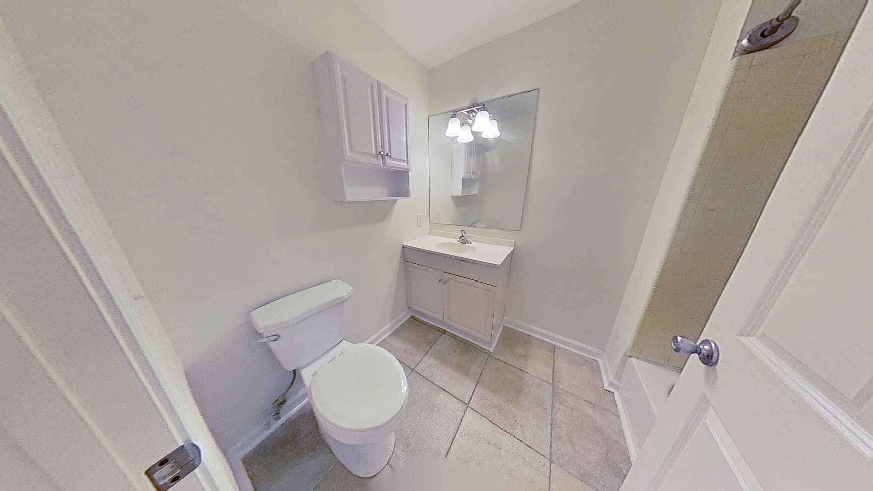 Restored bathroom with repaired ceiling and clean finishes after water damage