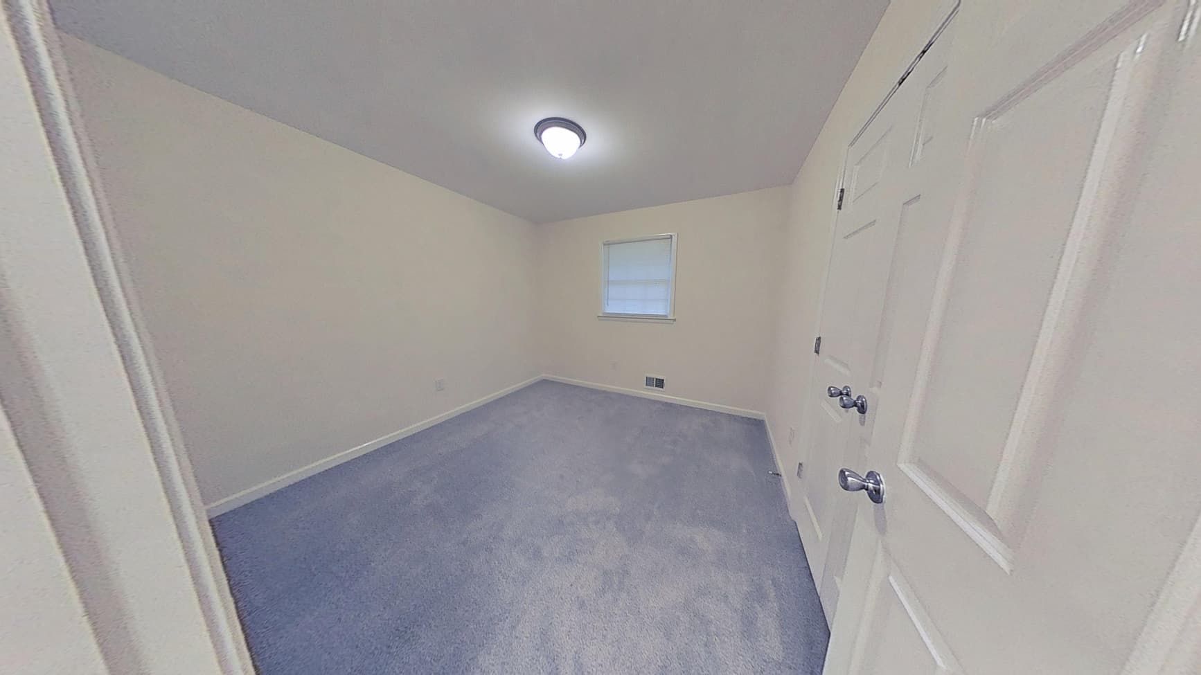 Fully restored bedroom with new ceiling and wall finishes after water cleanup