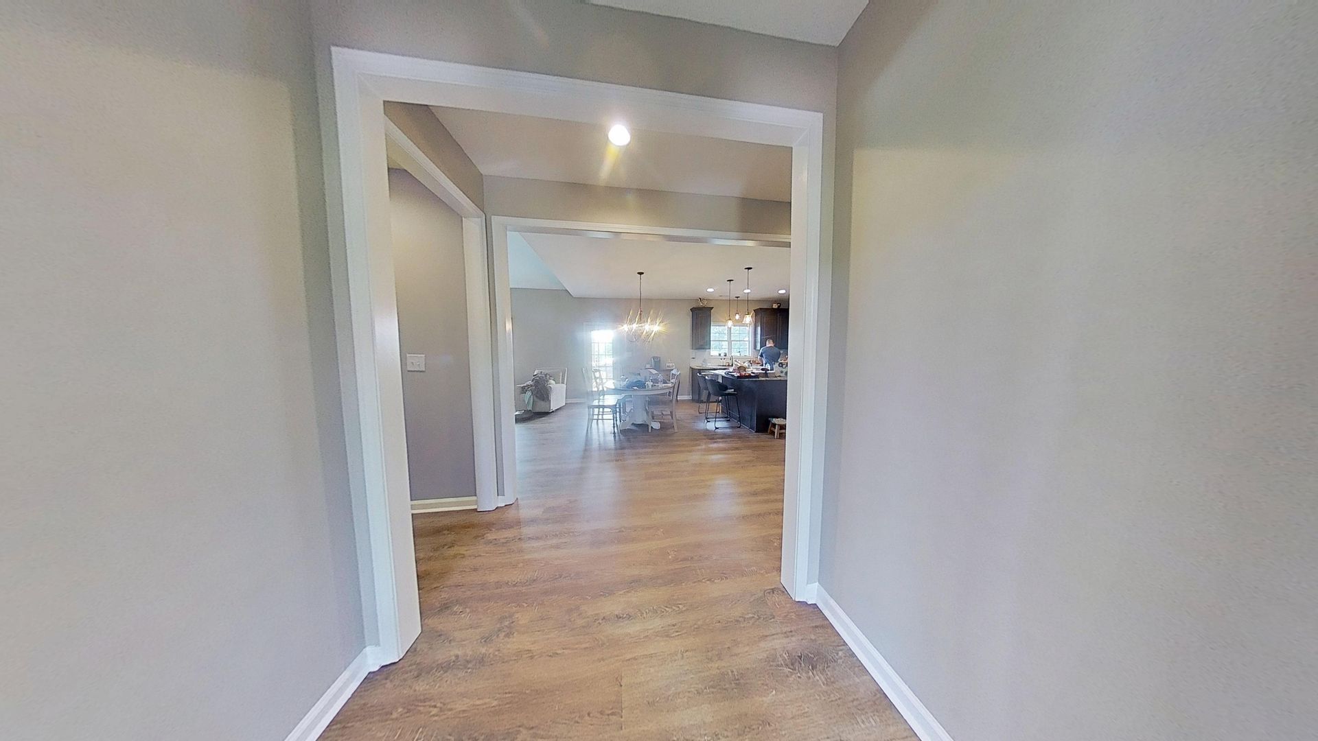 Kitchen after water mitigation with restored flooring in Monroe home