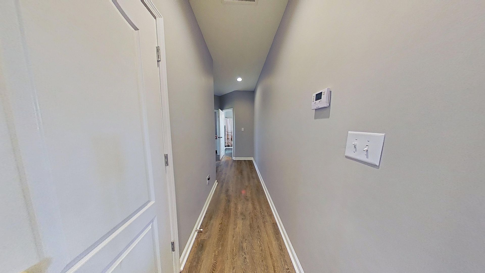 Hallway after water damage restoration with new flooring