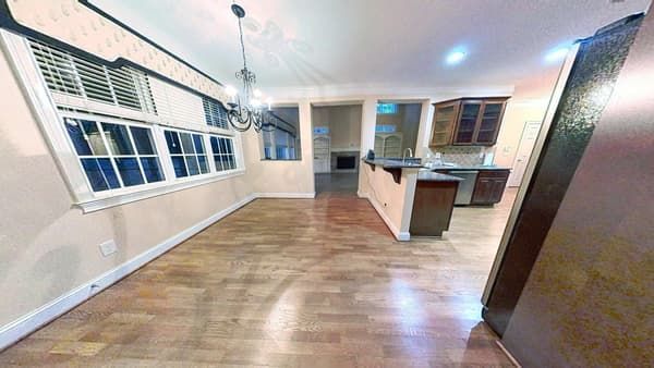 Fully restored kitchen with new flooring after water damage repair