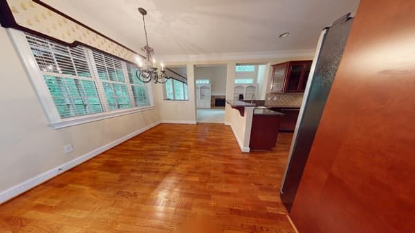 Kitchen with water damage to flooring before restoration
