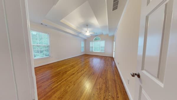 Living room with water damaged floors before restoration