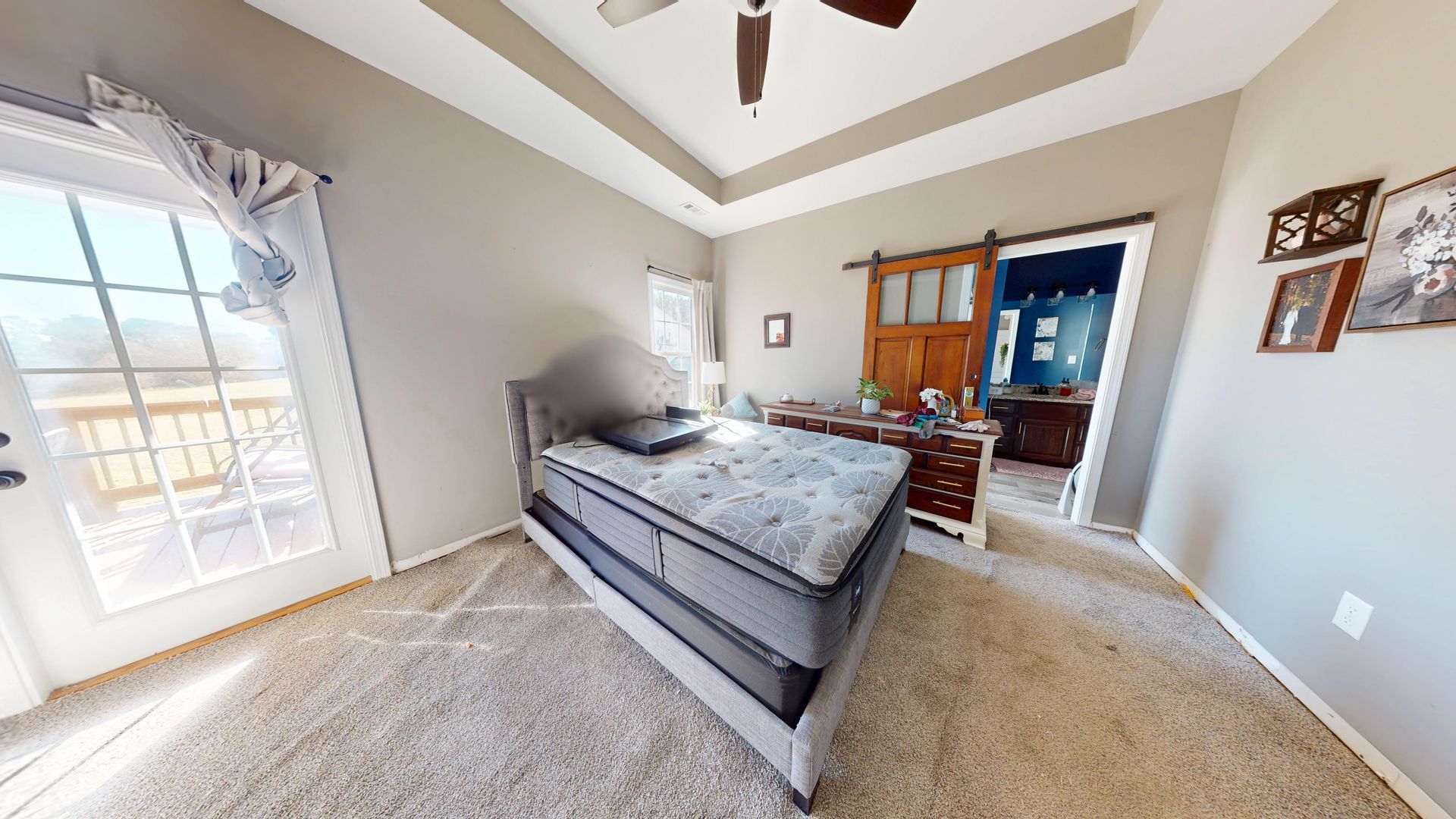 Master bedroom before water damage restoration with flood-damaged flooring