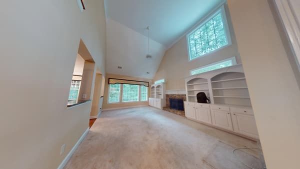 Second bedroom with water damaged floors before restoration