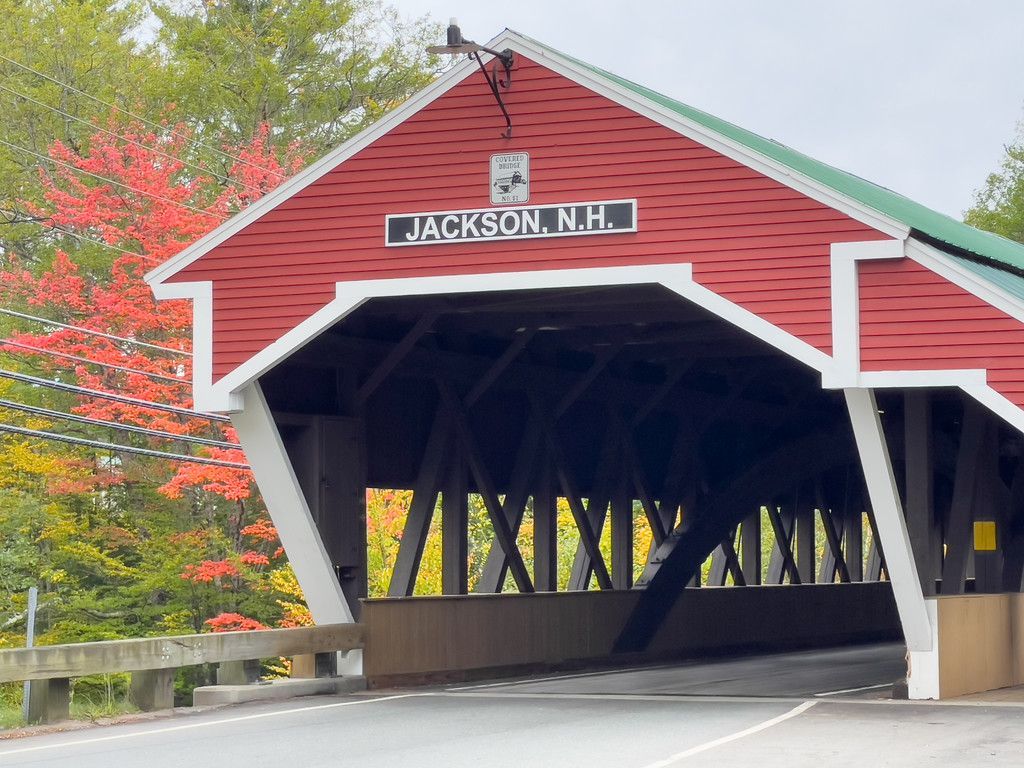 A red and white covered bridge in jackson new hampshire