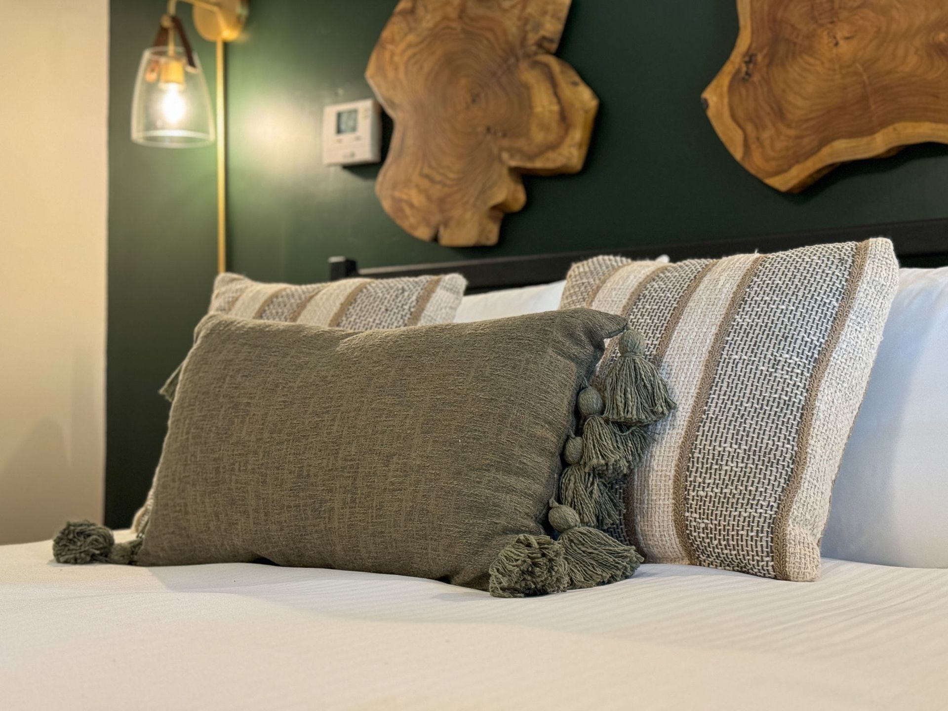 A bed with a lot of pillows on it