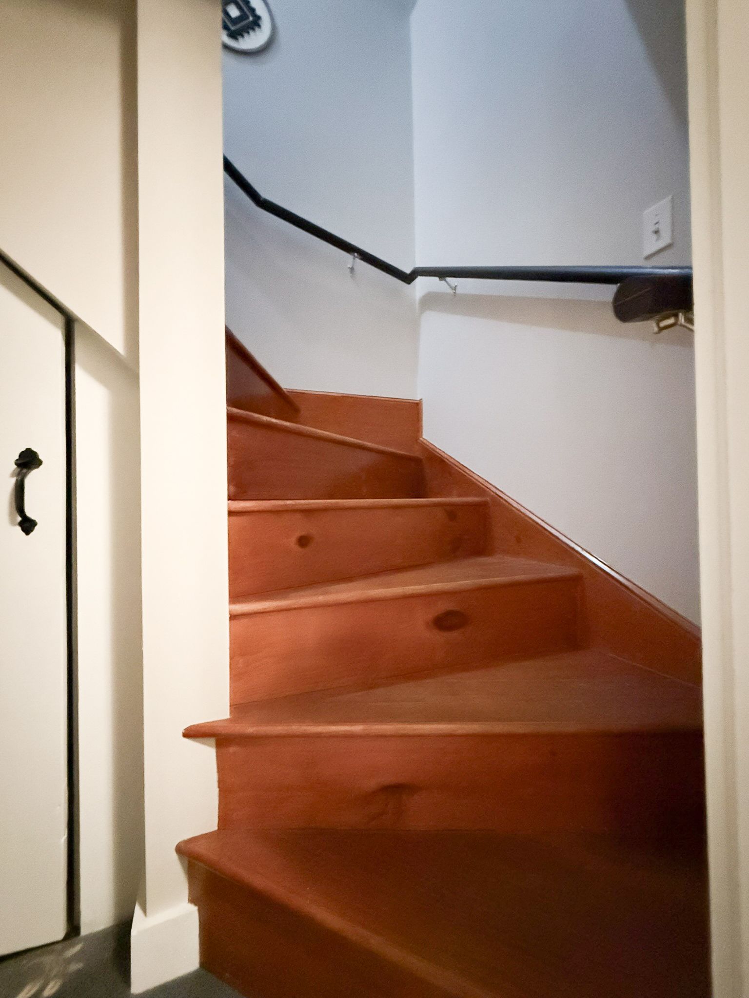 A wooden staircase leading up to the second floor of a house