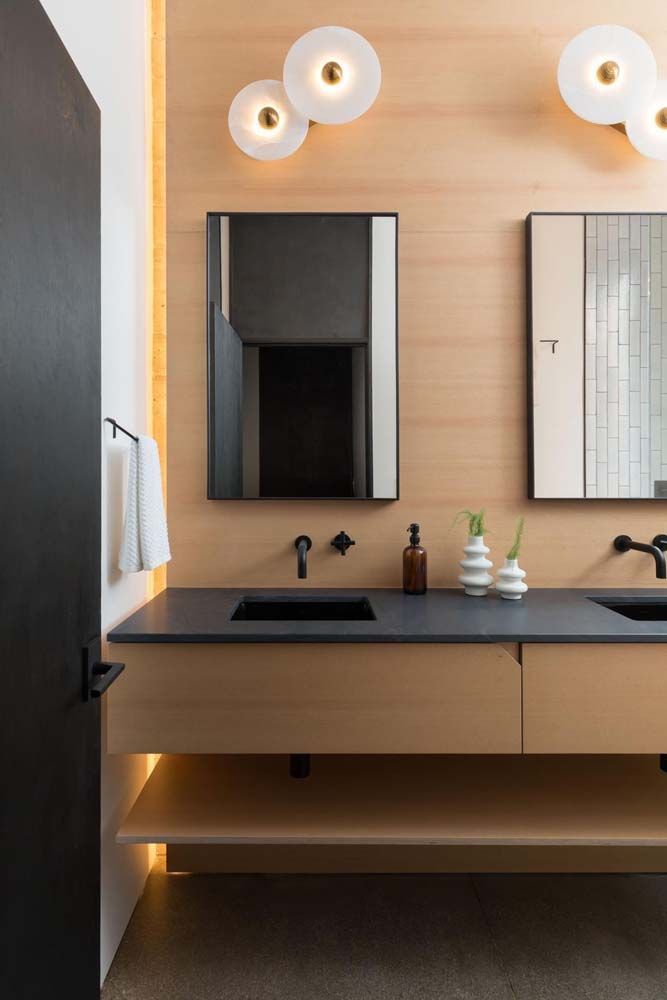 A bathroom with a sink and a mirror on the wall