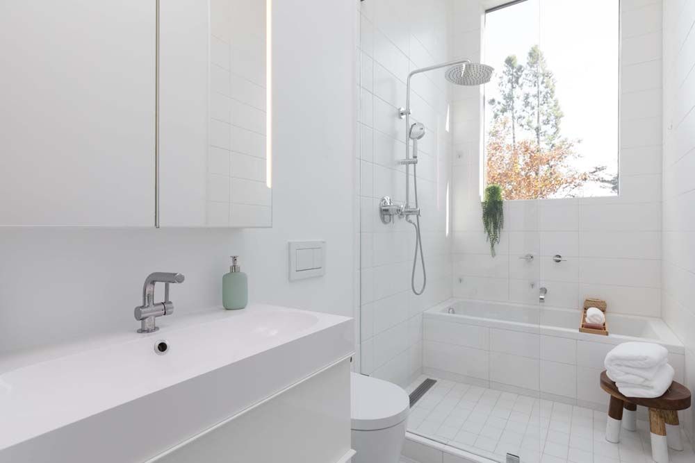 A bathroom with a sink , toilet , bathtub and shower.