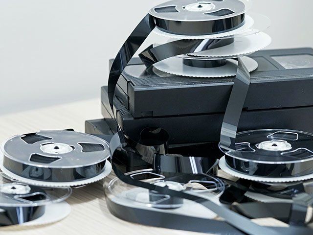 VHS tapes and roll on table