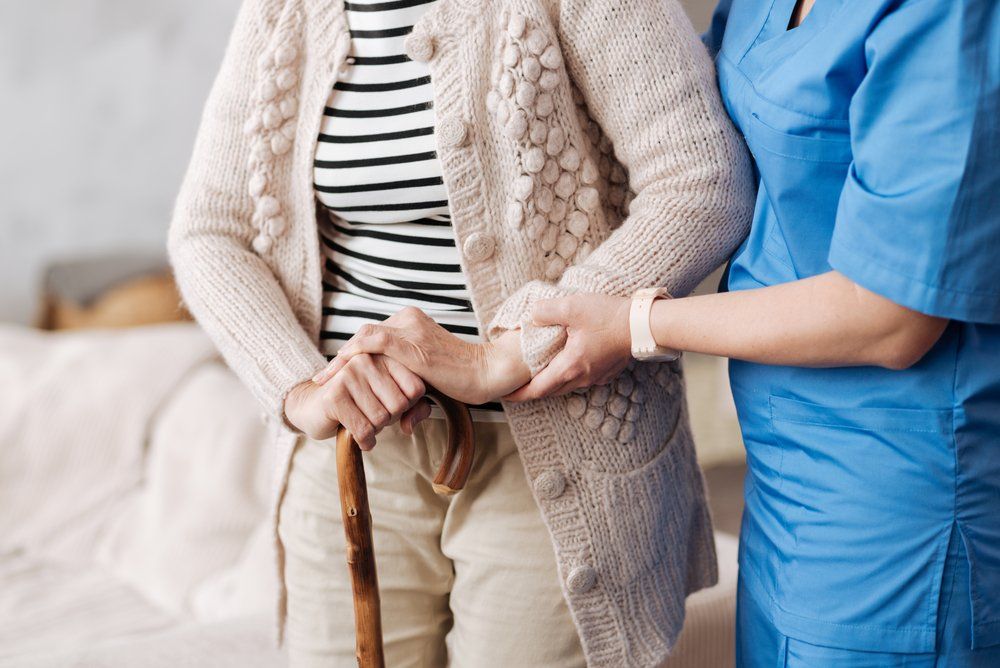 Nurse Helping Patient — General Podiatry in Urunga, NSW