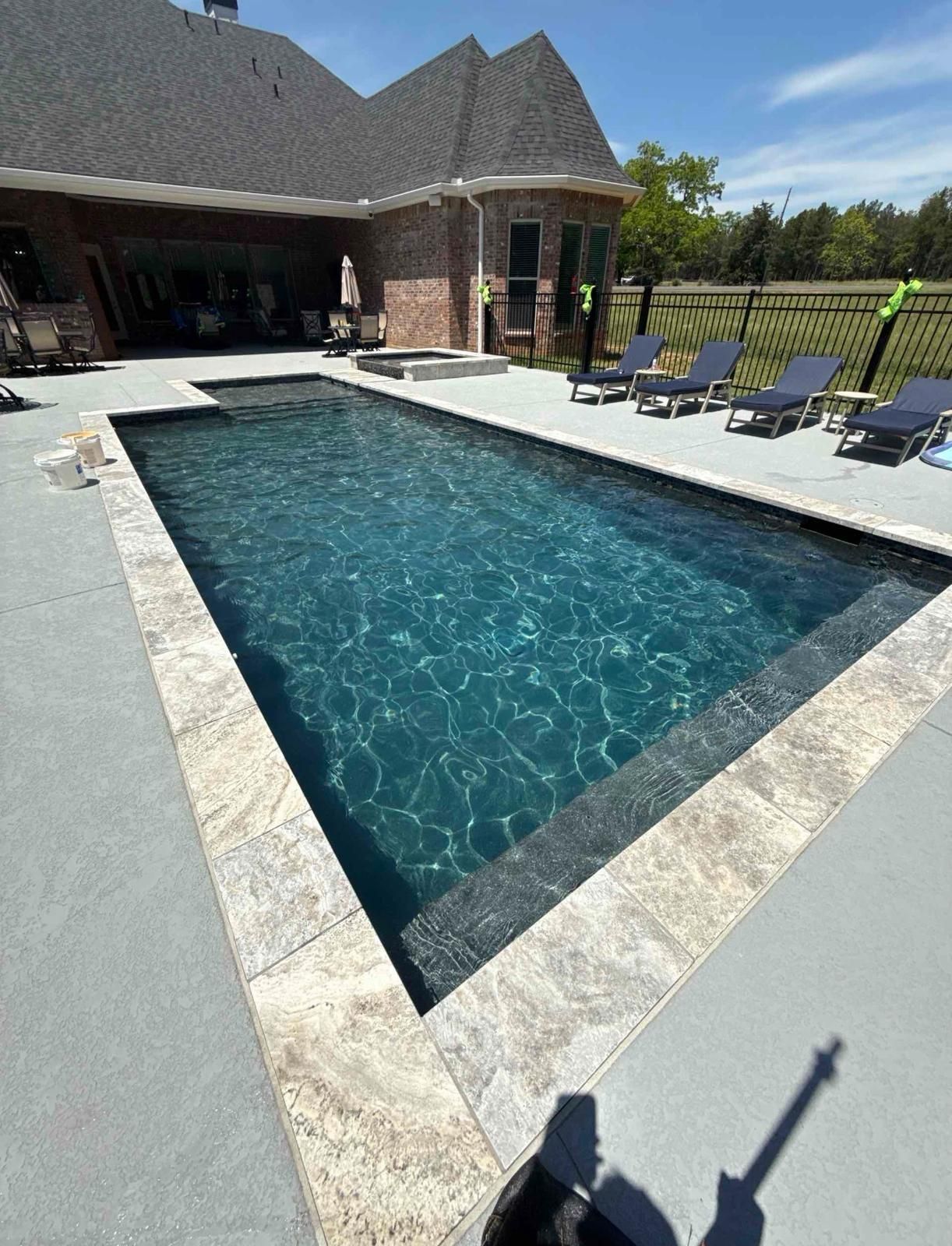 A swimming pool with stairs leading up to it
