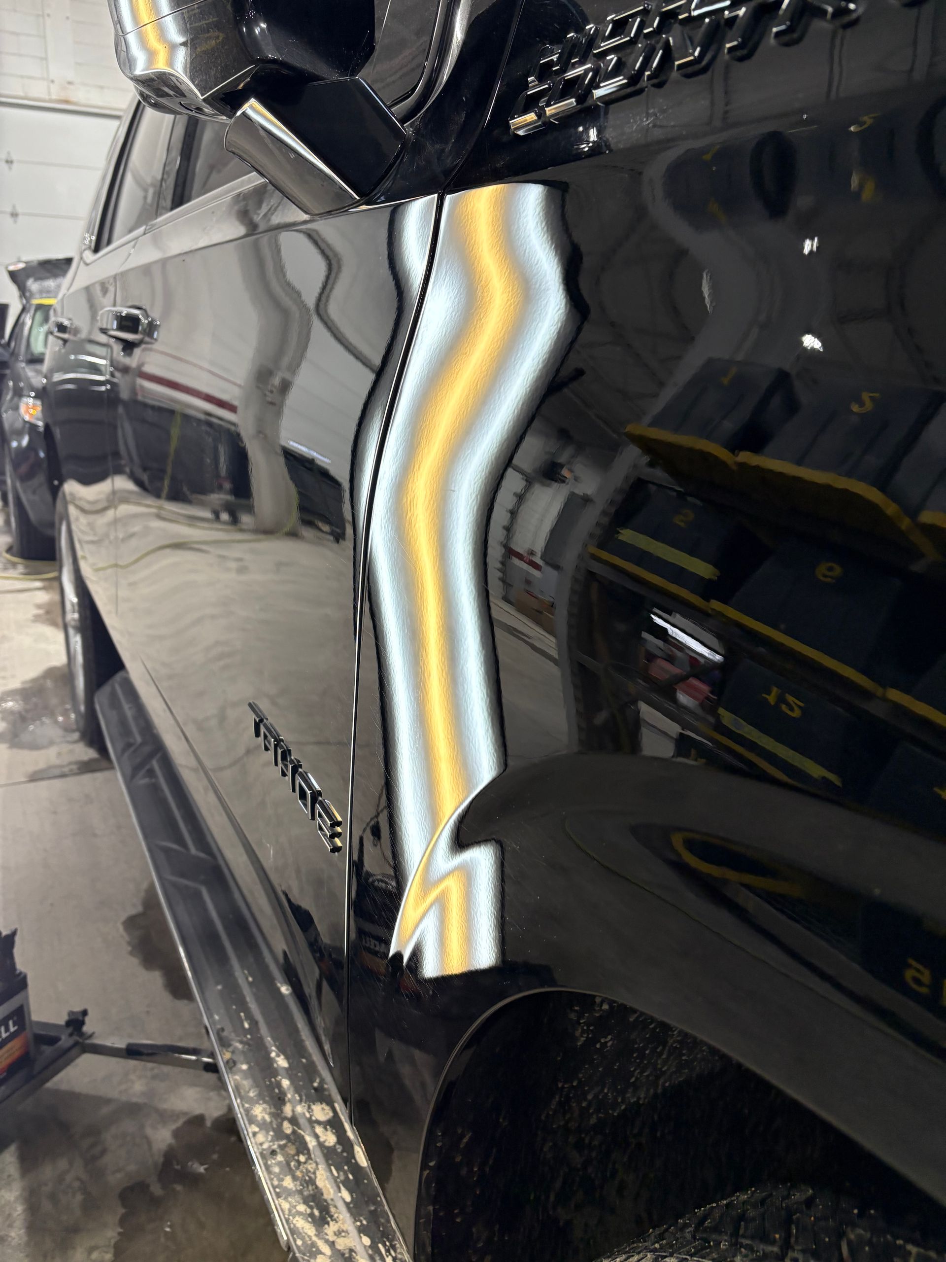 2024 Chevy Tahoe after paintless dent repair of body-line crease in Highland Indiana  