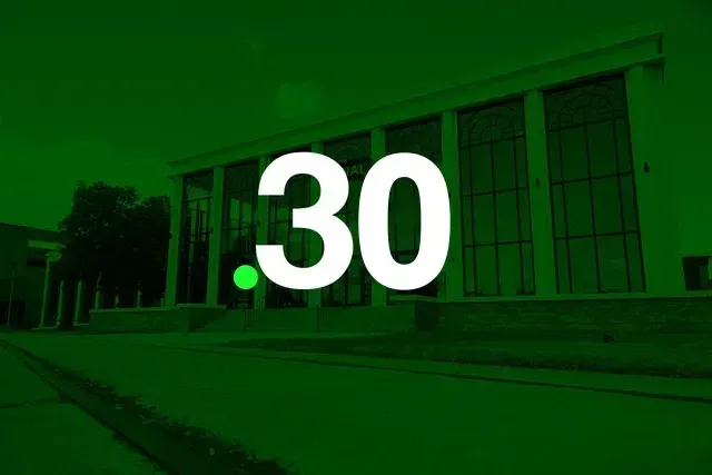 Green-tinted building exterior with large white “30” centered on the image.