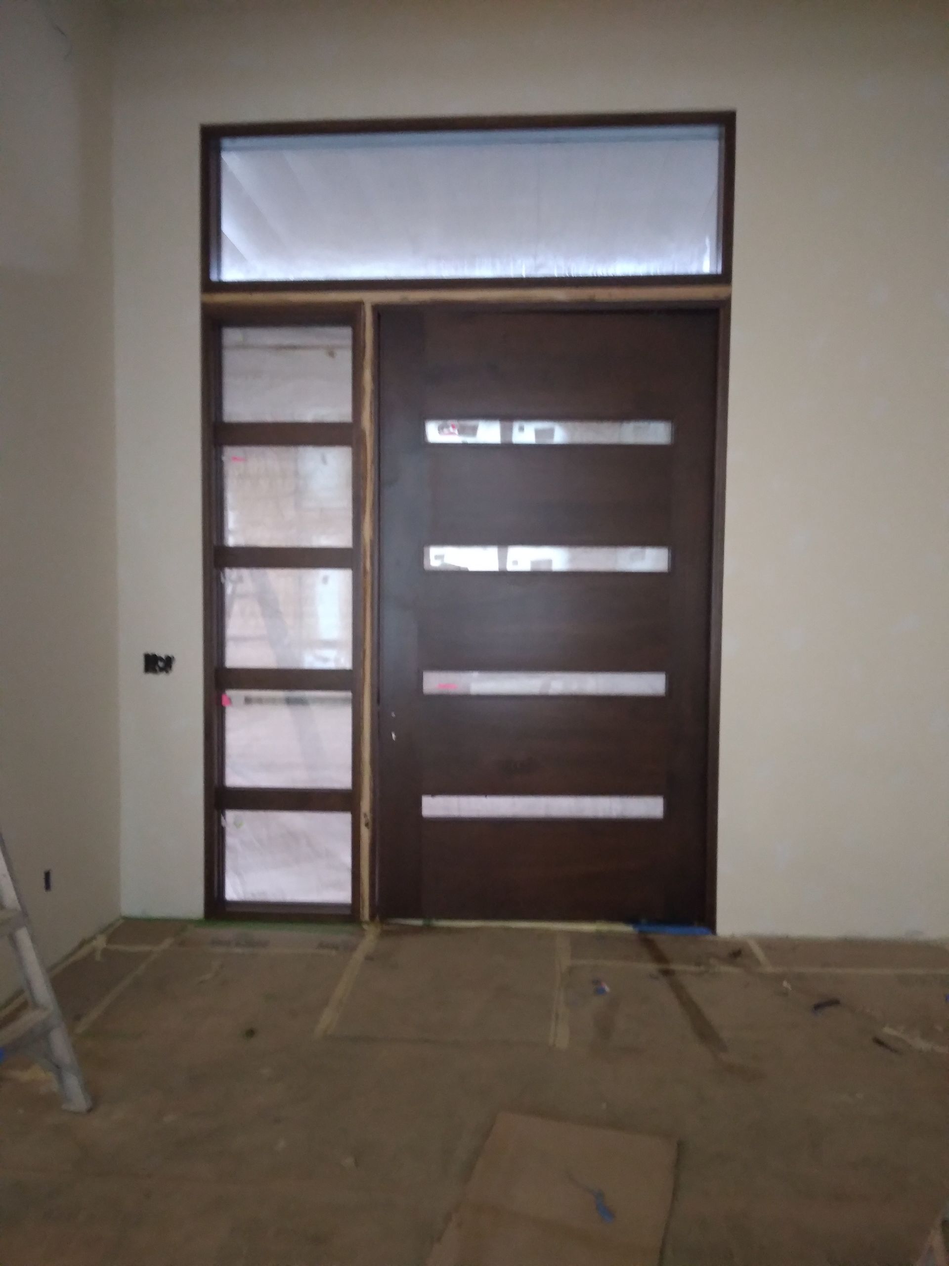 A room with a door and a window in it