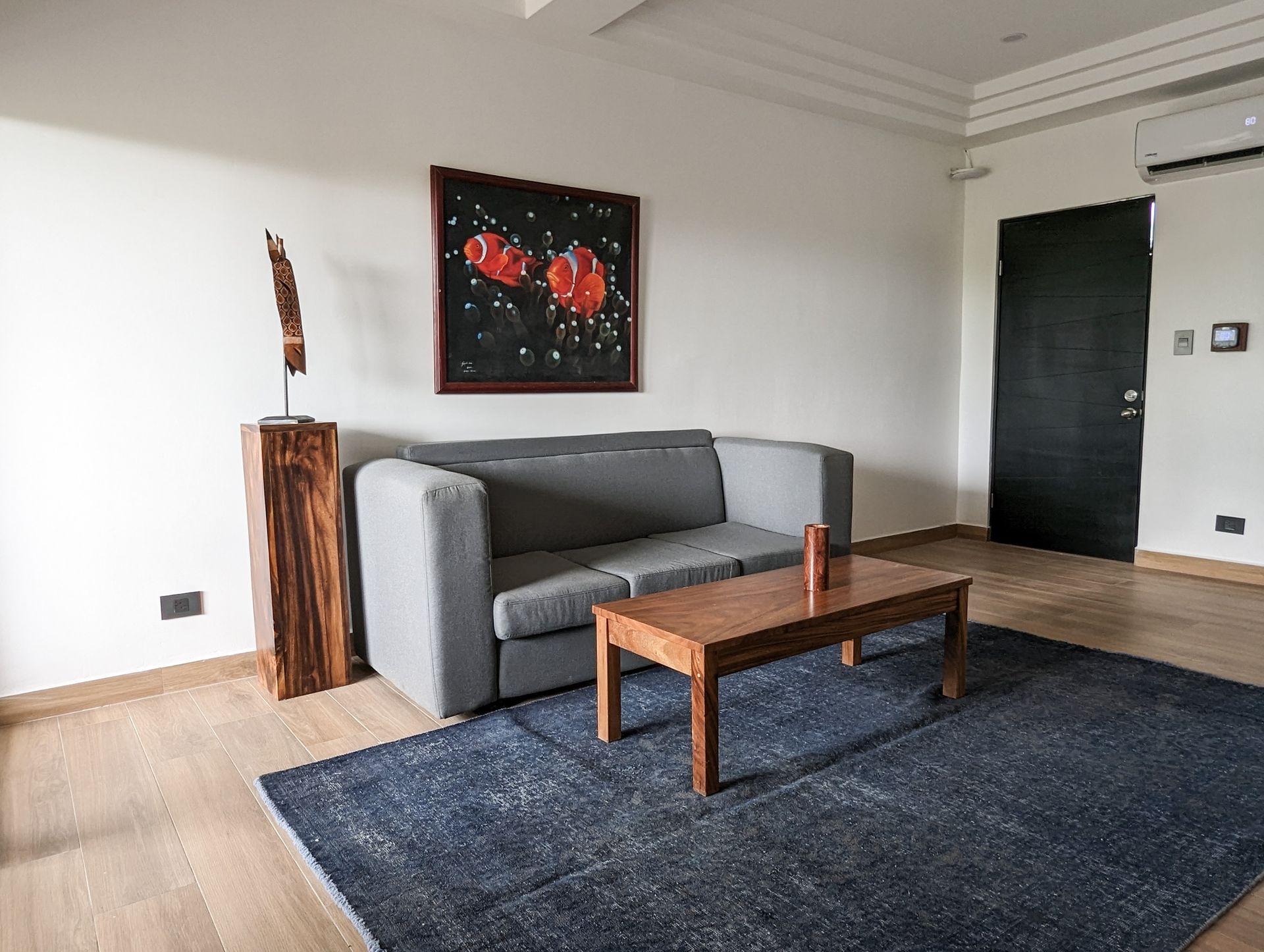 There is a couch and a coffee table in the living room.