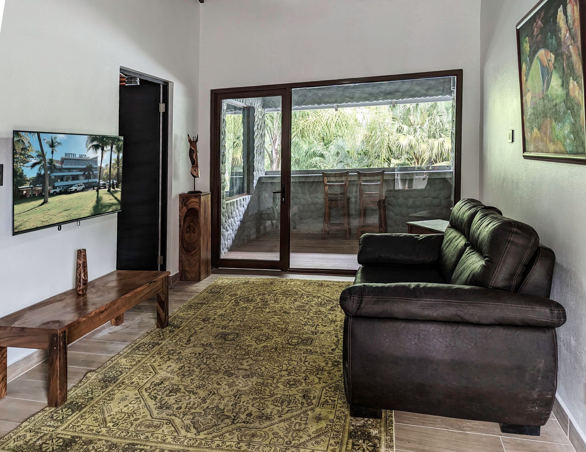 A living room with a couch and a flat screen tv