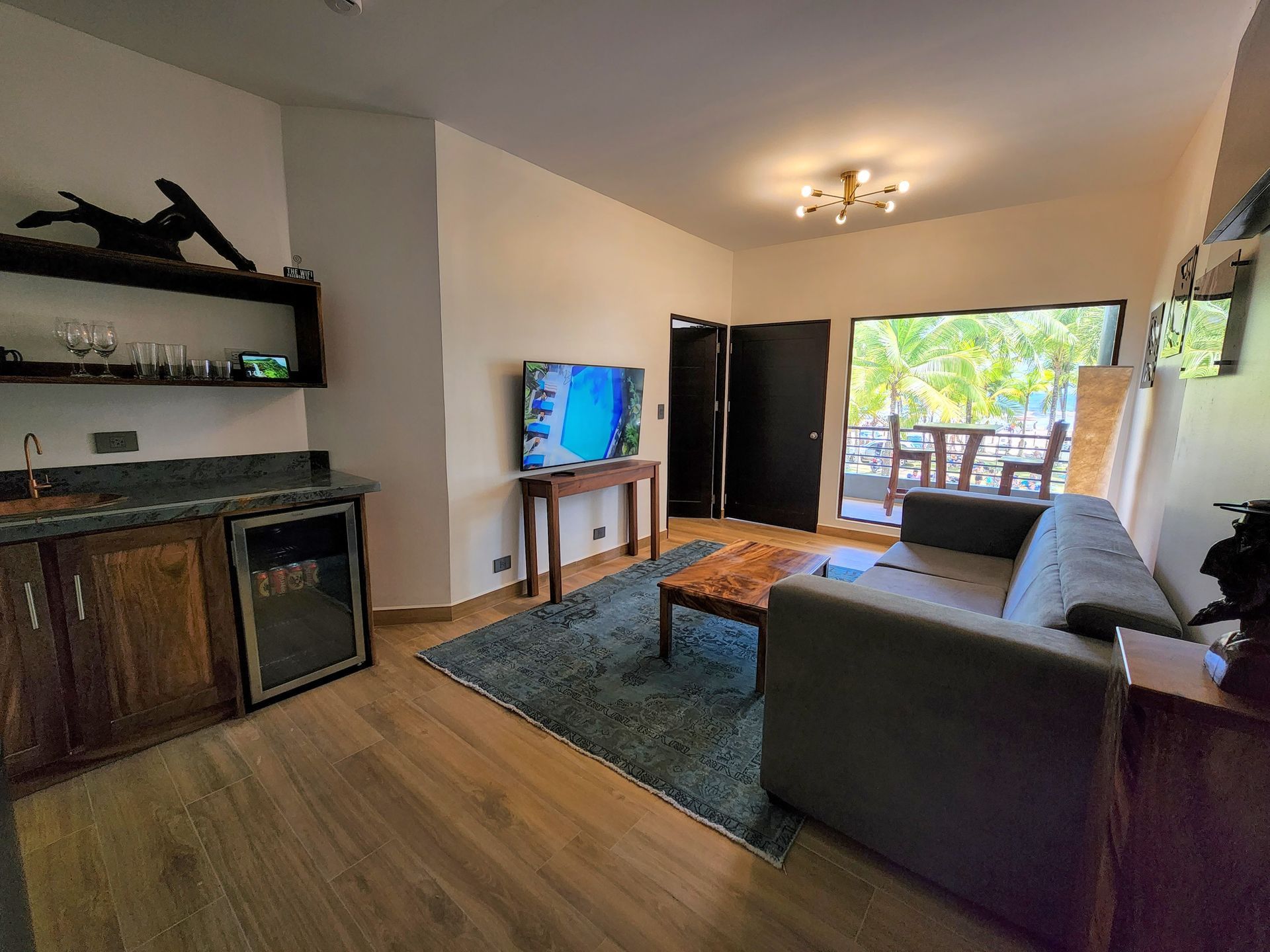 A living room with a couch , table , and television.