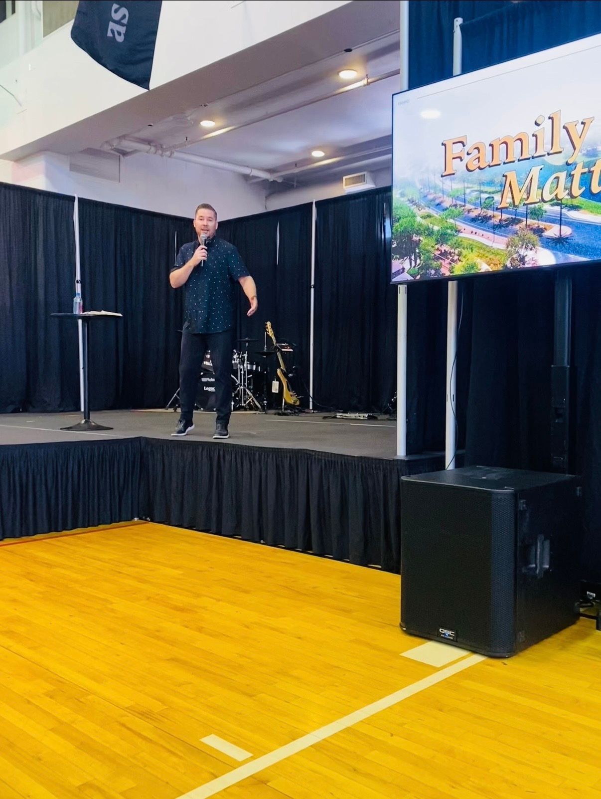 Chad Galbreath speaking on a stage at a Family Matters event