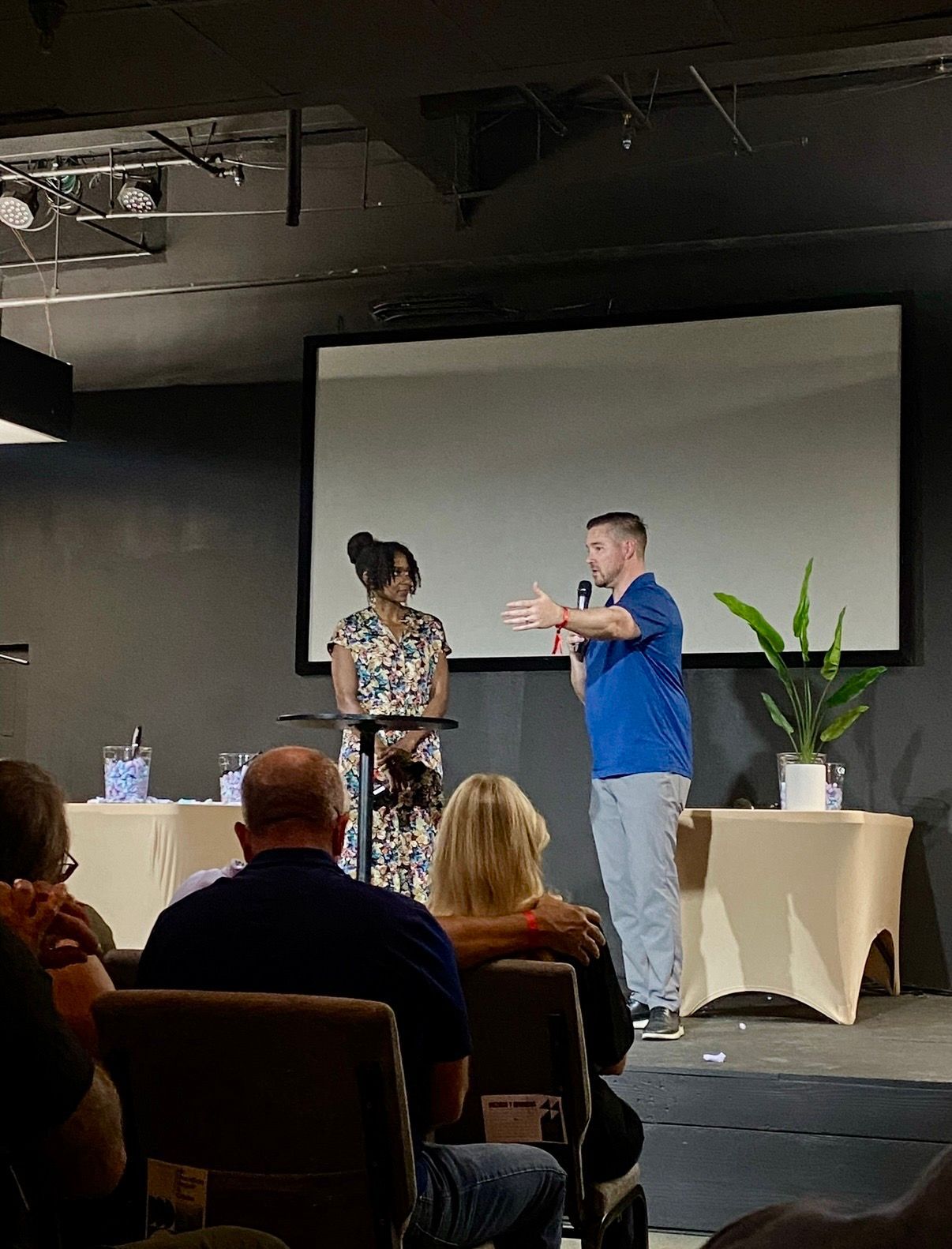 Chad and Sarah-Gayle Galbreath teaching in front of a seated audience