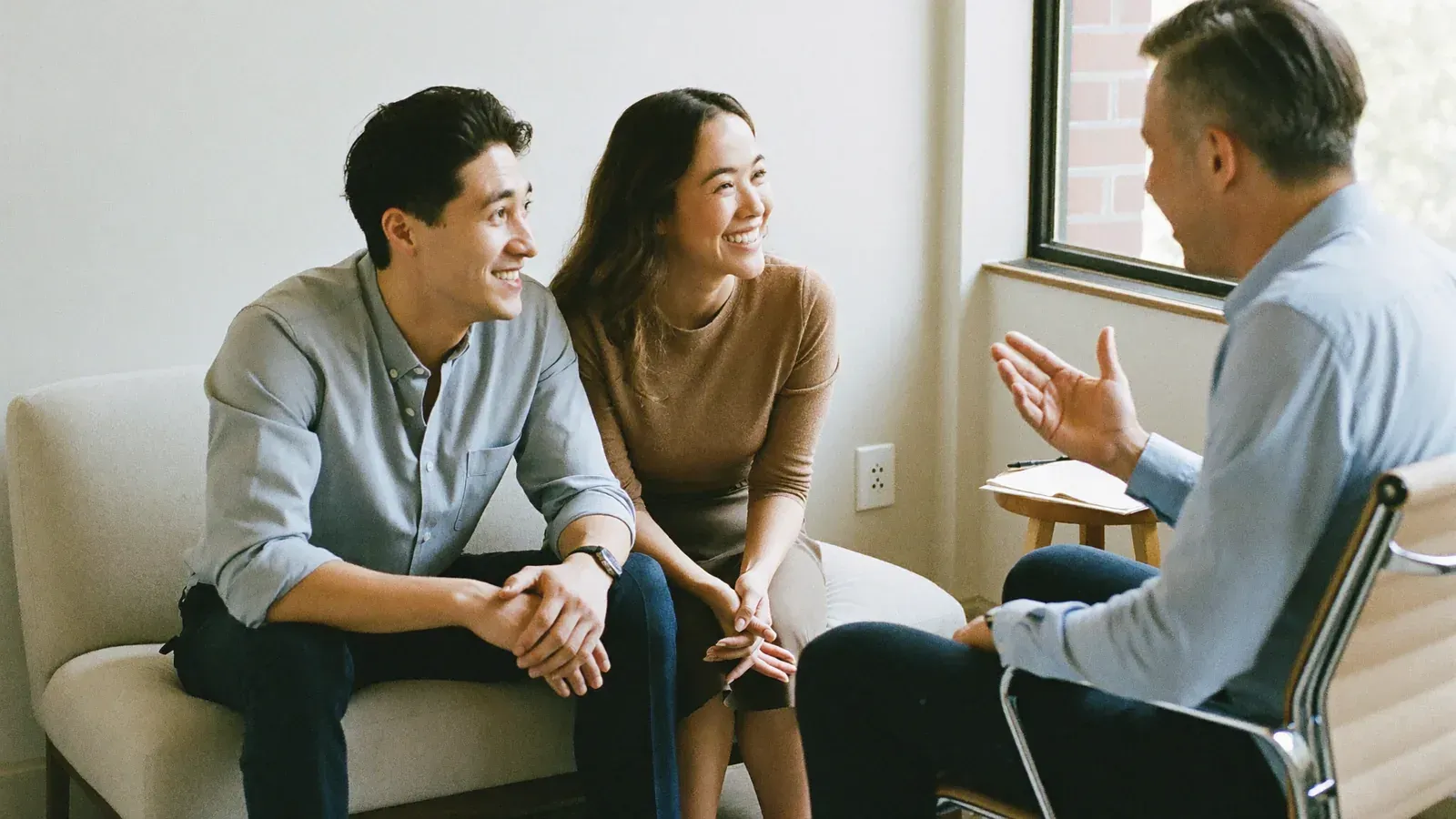 A marriage coach walking a couple through a communication process during a marriage coaching session for a Gilbert Arizona couple
