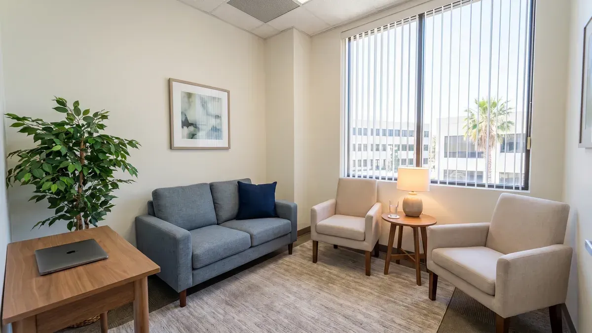 Private marriage counseling office in Chandler Arizona with a loveseat and two armchairs set up for a two day marriage intensive