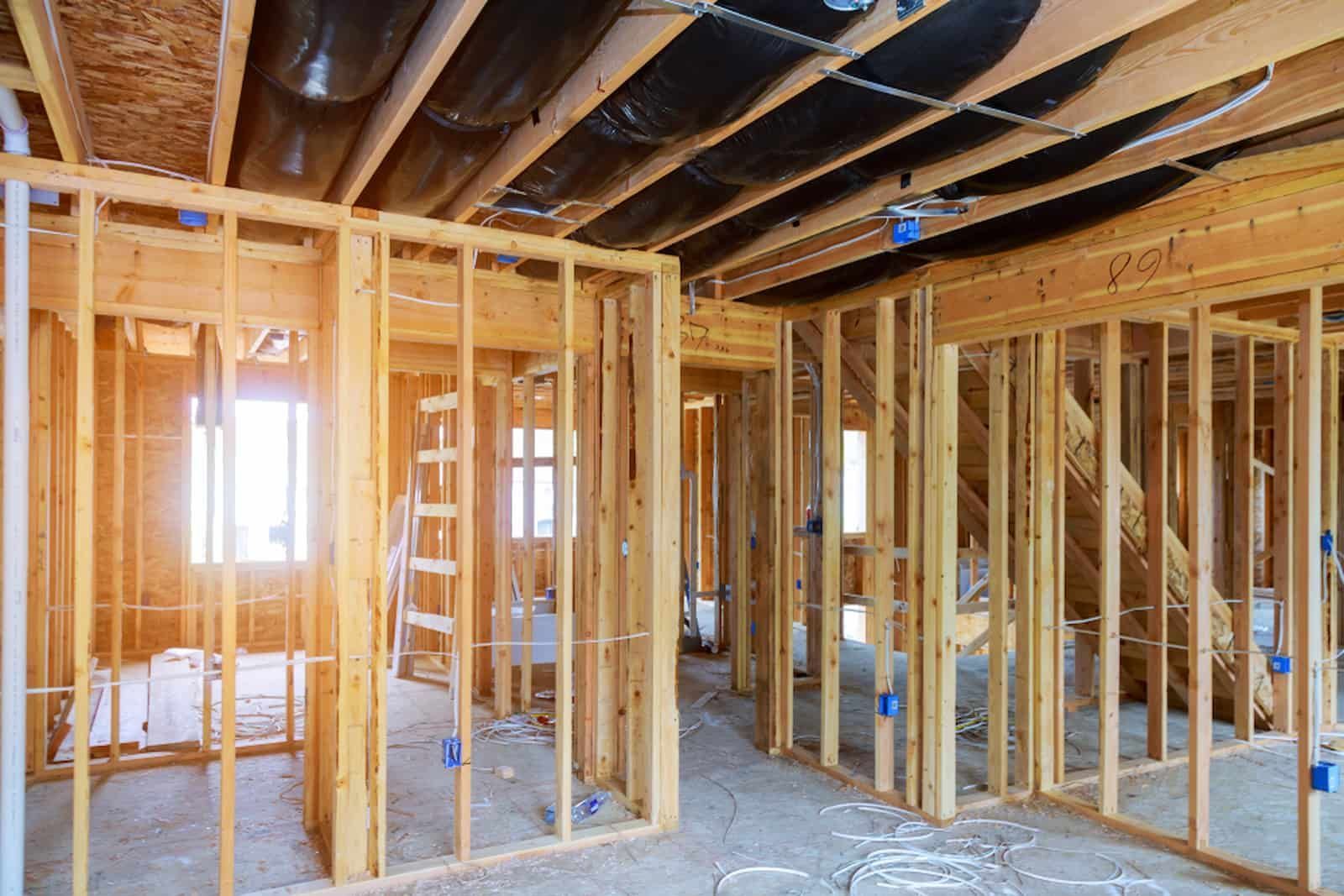 A House Is Being Built with Wooden Beams — MJ Watson Construction and Maintenance in Wagga Wagga, NSW