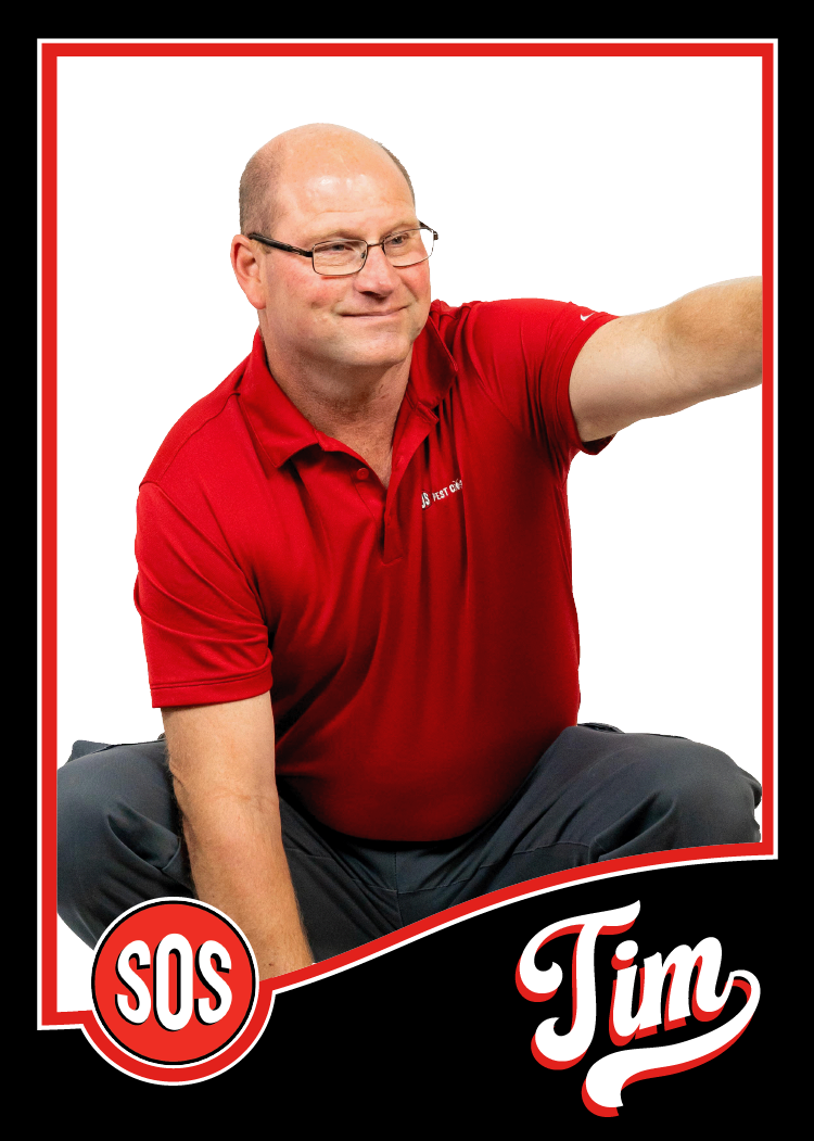 Time is squatting in a silly pose. He is the director of Business Development