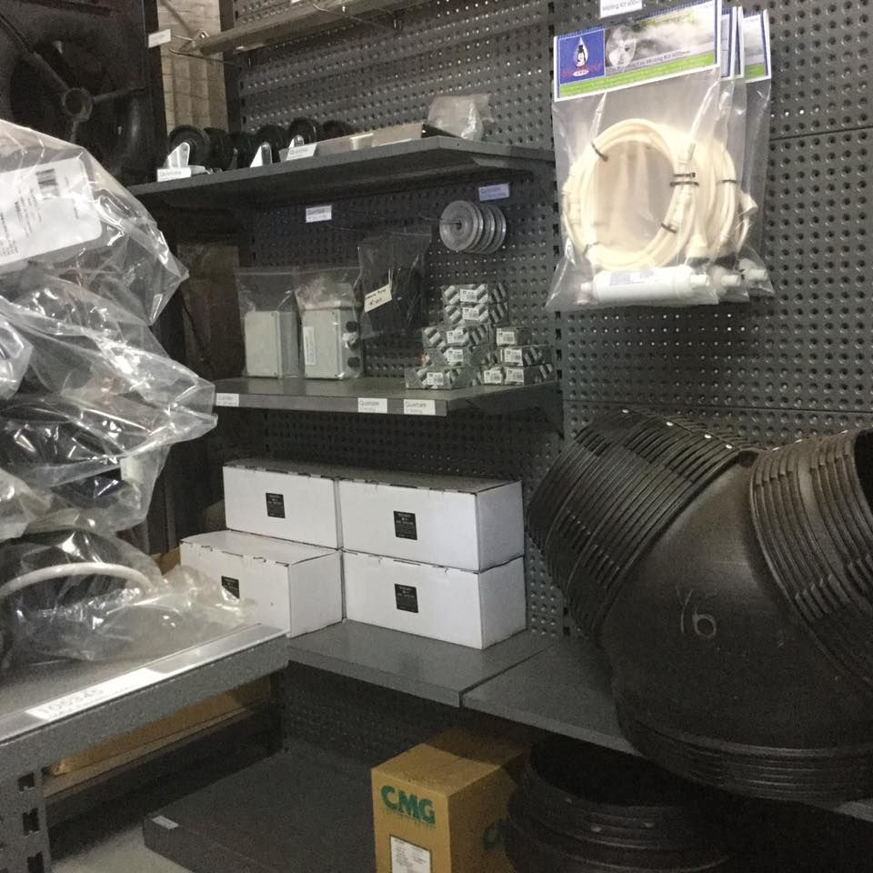 Shelves Stocked With Plumbing Supplies, Including Pipes — Cumming Airconditioning & Sheetmetal in Ryan, QLD