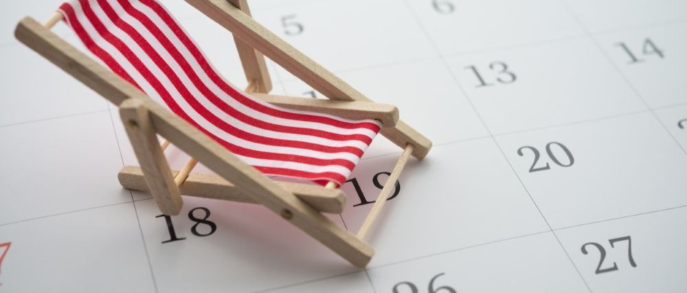 Vacation planning calendar with beach chair.