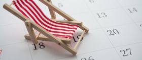 Vacation planning calendar with beach chair.