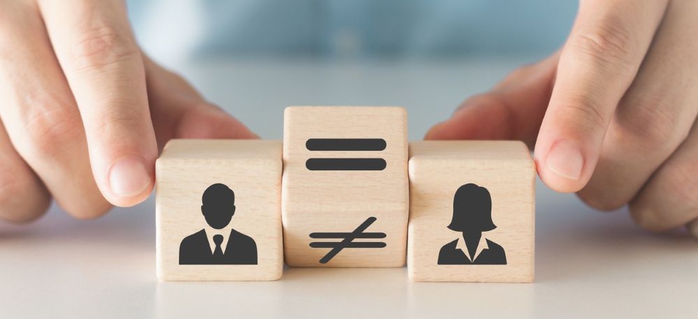 Pay equity and equal pay comparison represented by male and female figures.