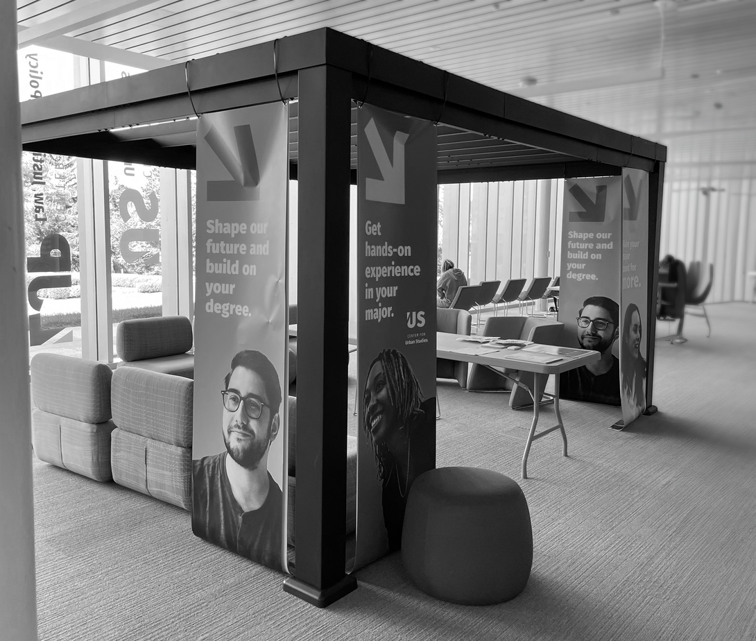 A black and white photo of a room on the Marywood Campus with tables and chairs