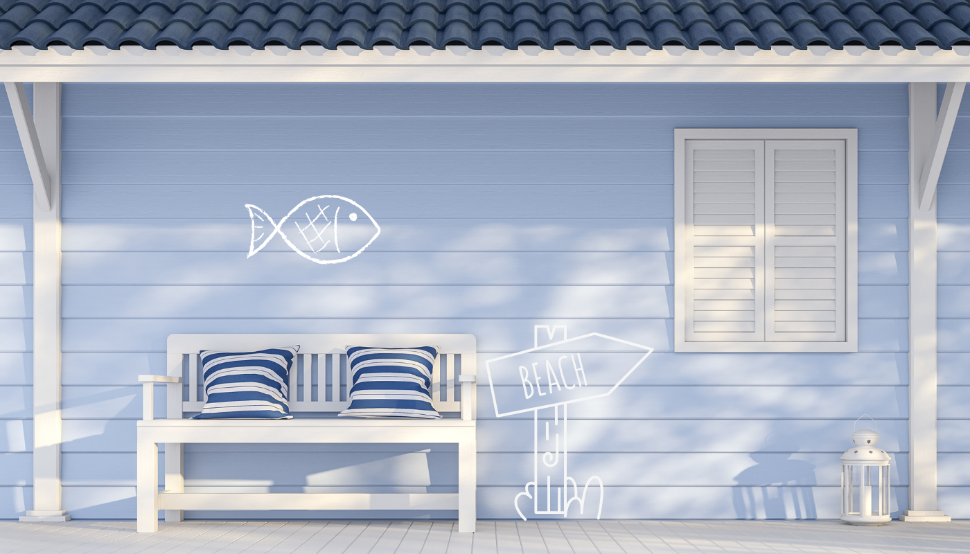 Blue coastal porch with white bench, pillows, fish drawing, and beach sign.