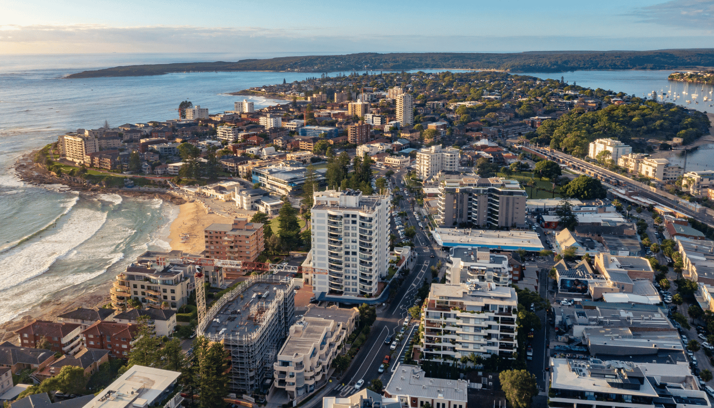 An aerial view of Cronulla surrounded by water and buildings.